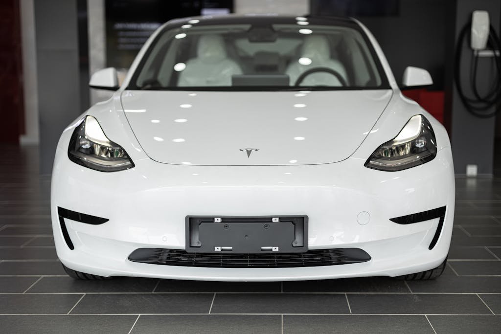 Close Up Photo of a White Car Tesla Model 3