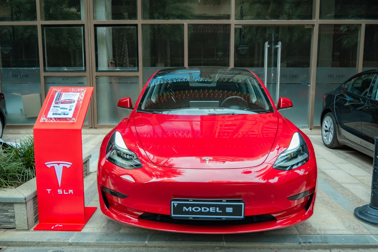 Close-Up Shot of a Red Luxury Car in the Parking Lot