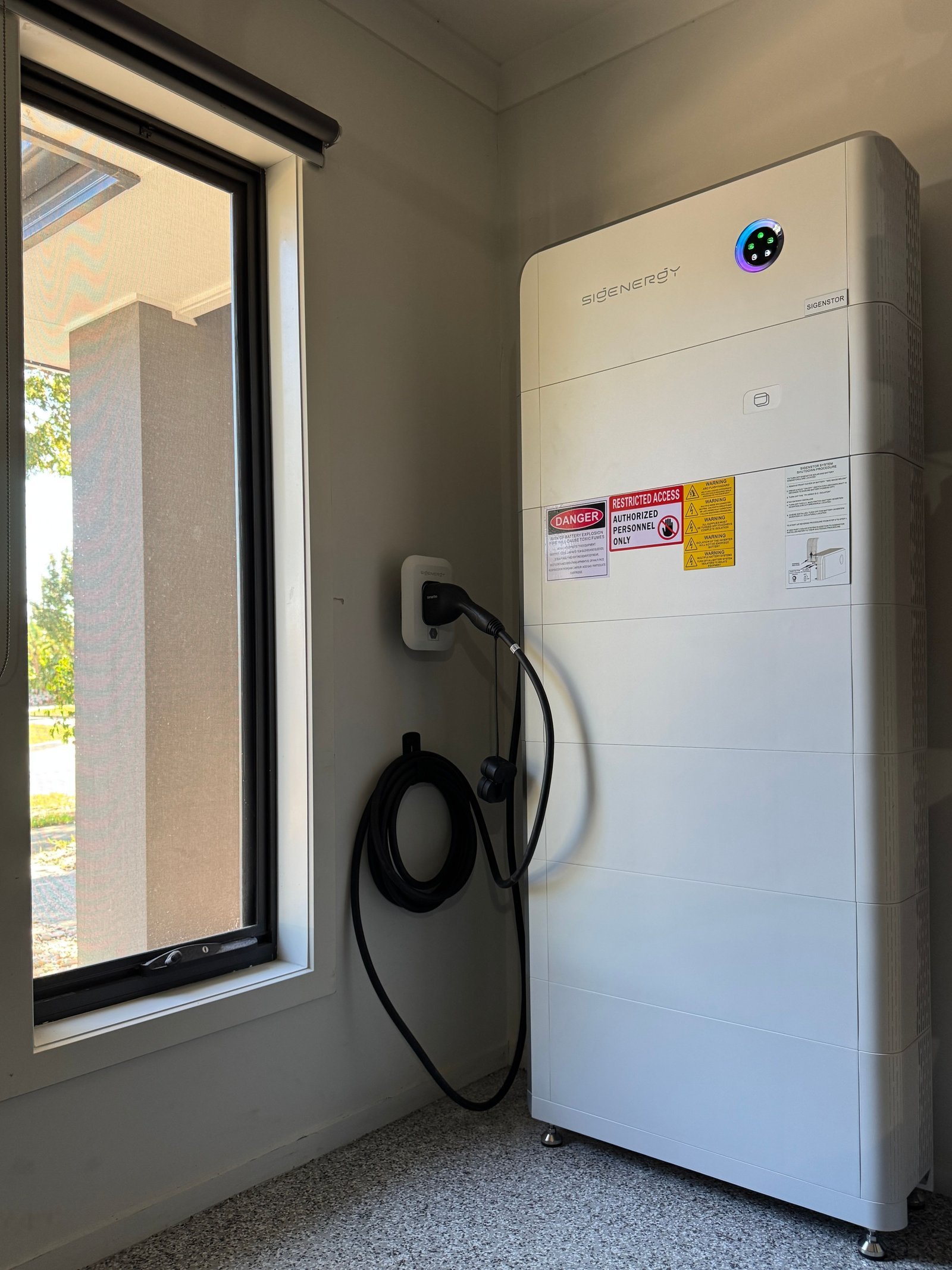 Kelvin's Sigenergy SigenStor battery stack and integrated EV DC charger module mounted on the wall