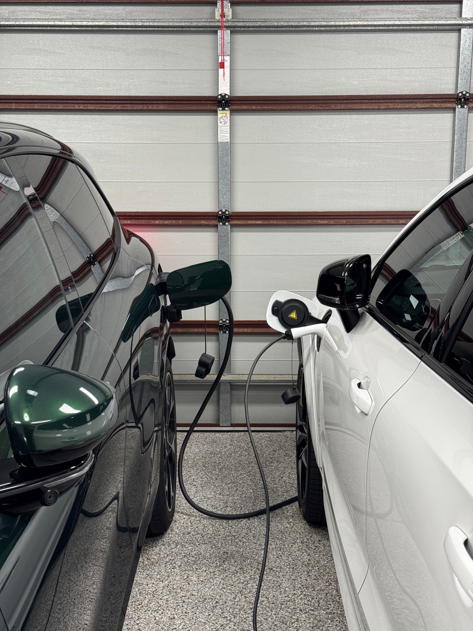 Kelvin's Volvo XC60 T8 PHEV plugged into the charging cable inside the carport
