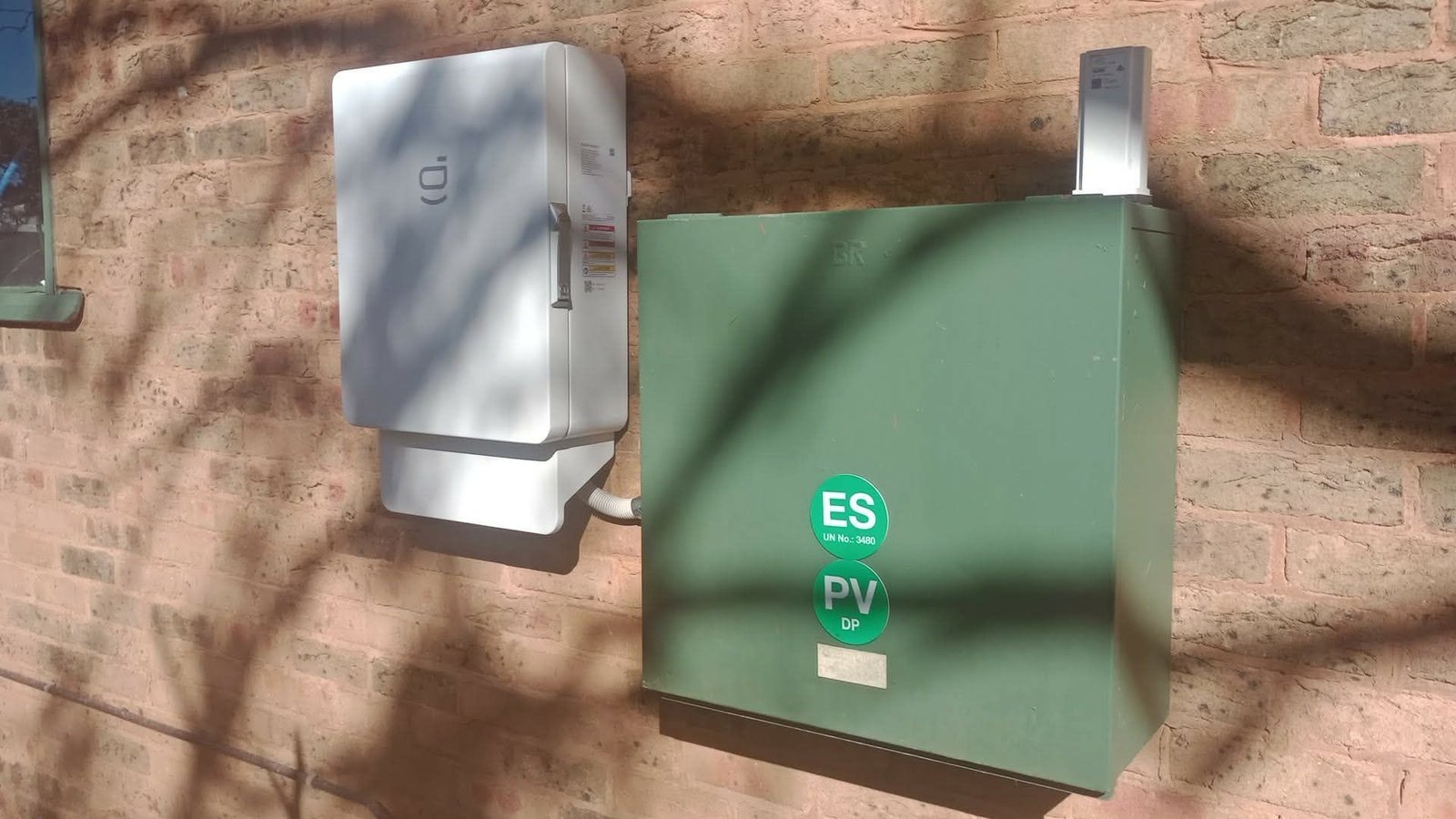 Sigenergy smart inverter and main solar electrical panel mounted on the external brick wall